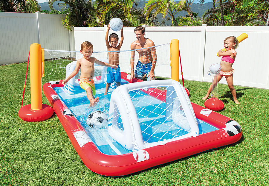 Adults having fun on a top-rated inflatable pool slide